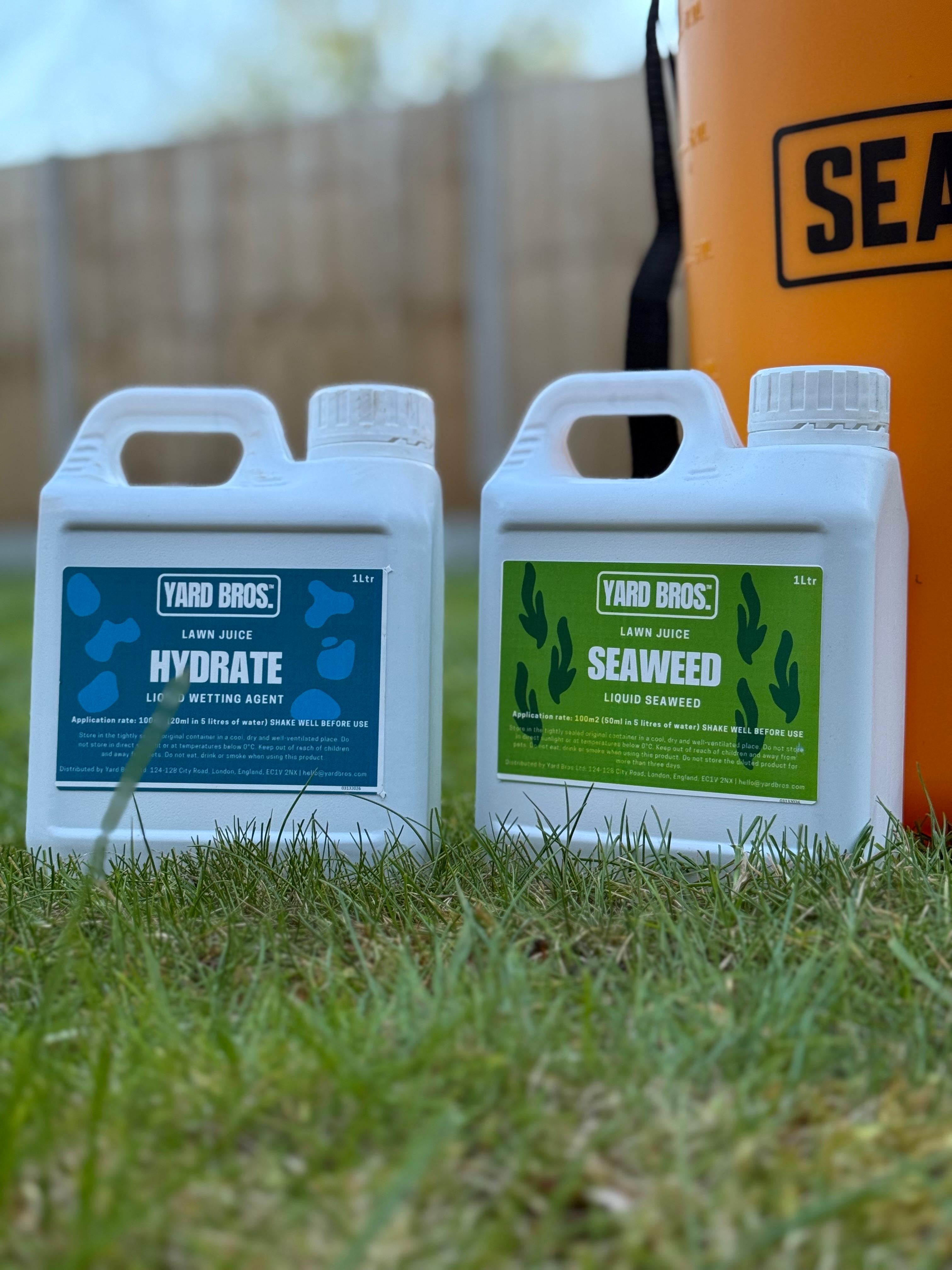 Two bottles of Yard Bros products on grass with a blurred background